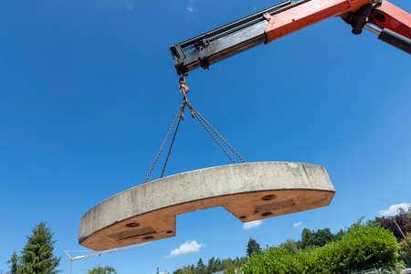 crane with counterweight under clear blue skyの写真素材
