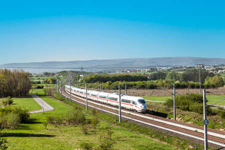 Raunheim, Germany - April 8, 2011: high speed train with full speed in landscape.のeditorial素材