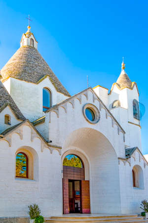 old historic trulli church in Alberobello, Italyの写真素材