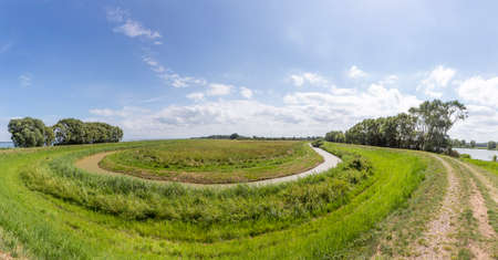 rural landscape in Usedom near Lutow with typical achterwsser creeks and agricultureの写真素材