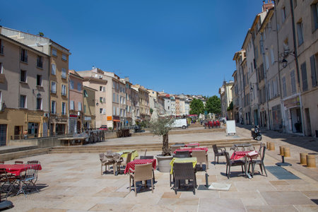 Aix en Provence, France - July 8, 2015: market square in Aix en Provence with restaurant tables without people in Franceのeditorial素材