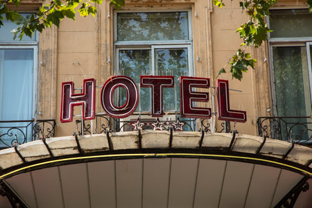 AIX EN PROVENCE, FRANCE - sign Hotel at an old facade in red letters in Aix en Provence, France. The hotel is assigned with three stars.のeditorial素材