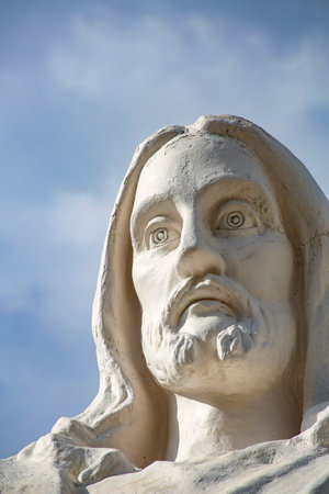 Cuzco, Peru - November 16, 2015: Statue of Jesus Christ in Peru under dark clouds.のeditorial素材
