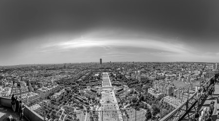 Paris, France - June 10, 2015: people watch the skyline of Paris from the upper platform at the eiffel tower.のeditorial素材