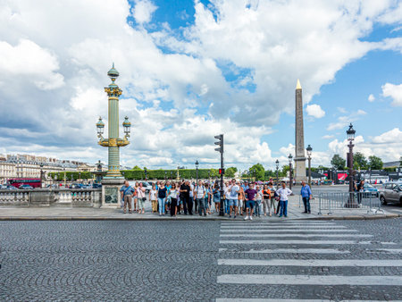 Paris, France - June 12, 2015: people cross the street at a traffic light for pedestrians at place de la concorde in the heart of Paris.at Champs dÂ´ Elysees.のeditorial素材