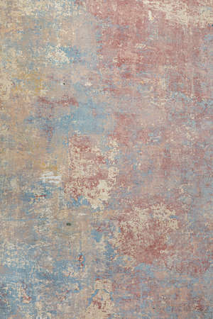 background of old wall with removed tapestry gives a harmonic look in paint of different ages