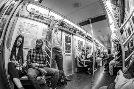 New York, USA - October 22, 2015: people at night travel in the metro in New York.