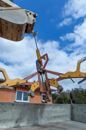 lifting claw at a crane is removed to trailerの写真素材