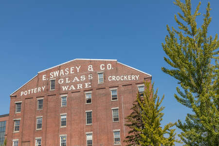 PORTLAND, USA - SEP 15, 2017: facade of historic brick building with advertising for Swasey Pottery, Glassware and Crockery in Portland, Maine, USA.のeditorial素材