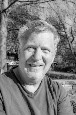 portrait of attractive man in the public garden
