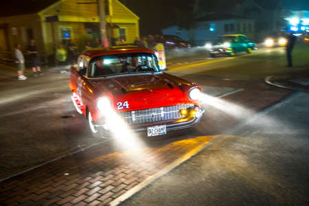 OLD ORCHARD BEACH, USA - SEP 15, 2017: Old vintage cars at the 24th Annual Old Orchard Beach Maine Car Show drive along by night the seven miles long beach street in Old Orchard Beach.のeditorial素材