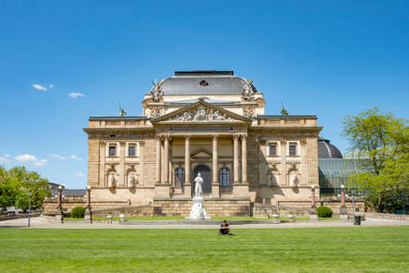 Wiesbaden, Germany - May 31, 2021: front of the Museum Wiesbaden, an exhibition house for art and nature in Wiesbaden with people relaxing at the park.のeditorial素材