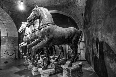 Venice, Italy - July 1, 2021: Ancient bronze horses inside the Basilica di San Marco in Venice. Famous quadriga from Constantinople. San Marco or St Mark's Basilica is the main landmark of Venice.のeditorial素材
