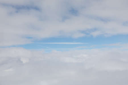 detail of sky with soft clouds and blue sky in the middle