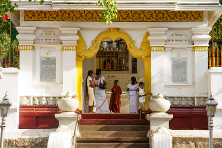 BODH GAYA, Sri Lanka - August 1, 2005: people worship at the famous Bodh Gaya tree in Bodh Gaya, Sri Lanka. It is famous as the place where Gautama Buddha is said to have obtained Enlightenment.のeditorial素材