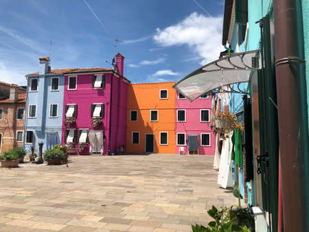 Burano, Italy - July 5, 2021: scenic narrow colorful houses at the venetian island of Burano, Venice, Italy.のeditorial素材