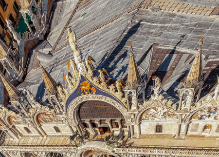 Venice, Italy - July 6, 2021: famous horses, lion and St. Mark on top of St Mark`s Basilica in Venice, Italy.のeditorial素材