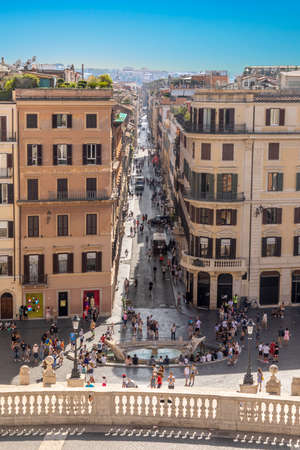 Rome, Italy - July 31, 2021: people enjoy Spanish stairs on Piazza di Spagna in Rome. Spanish stairs with the Fountain Barcaccia in Rome is famous touristic destination.のeditorial素材