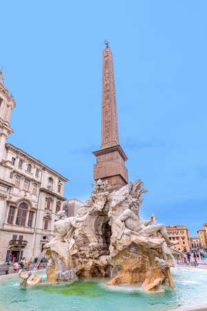 Rome, Italy - August 2, 2021: people visit Fiumi fountain located at the north end of the Piazza Navona - a sea horse with cupids and other sculptures in the background; Rome, Italy.のeditorial素材