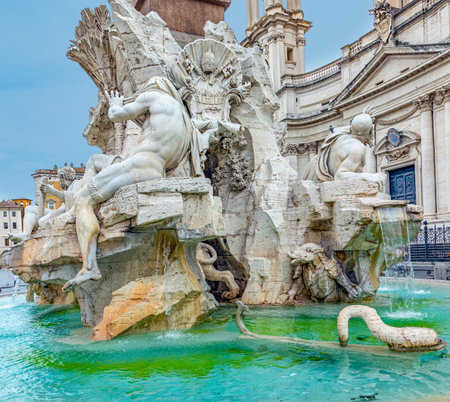 fiumi Fountain ocated at the north end of the Piazza Navona - a sea horse with cupids and other sculptures in the background, Rome, Italy.の写真素材