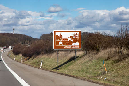 Holzheim, Germany - March 16, 2021: german highway on a sunny day with soft clouds at Laubach castle.のeditorial素材