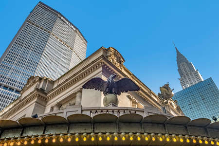 New York, USA - October 4, 2017: Grand central building with eagle at entrance and chrysler and MEetlife building in background.のeditorial素材