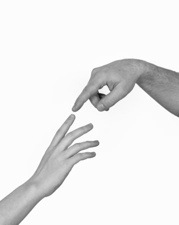 Male and female hands touching each other by index finger