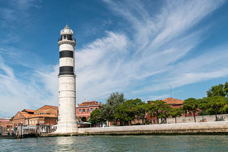 The ancient lighthouse of the island of Murano made of white stones. Punta Faro, Venice lagoon, Veneto, Italy, Europe.の写真素材