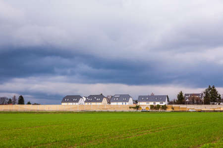 Schwalbach, Germany - March 29, 2010: new built houses at the highway and agricultural fields in...