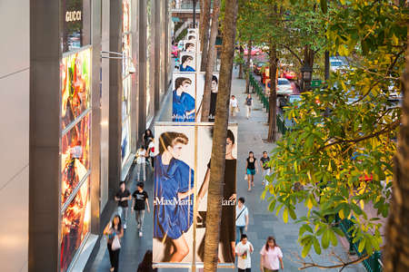 Bangkok, Thailand - May 7, 2009: outside advertising with posters at modern shopping center Central world in Bangkok, Thailand. Central World is the biggest shopping center in Bangkok and offers luxurious goods in western style.のeditorial素材