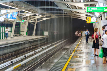 Bangkok, Thailand - May 9, 2009: people in the metro station Chit Lom in rainy season and heavy rain...