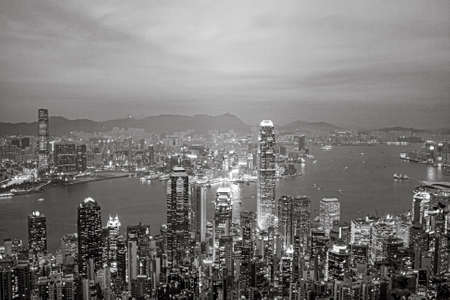Victoria, Hong Kong - January 8, 2010: view by night from Victoria peak to the skyline and harbor of...