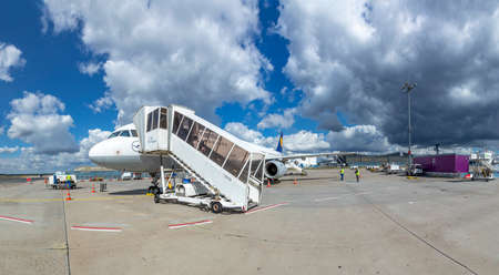 Frankfurt, Germany -July 11, 2020: boarding the Lufthansa aircraft at the apron with a non terminal...
