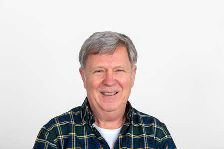 portrait of handsome smiling mature man isolated on white background