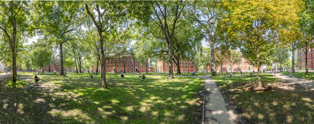 Cambridge, USA - September 13, 2017: Students and tourists rest in lawn chairs in Harvard Yard, the open old heart of Harvard University campus in Cambridge, MA, USA.のeditorial素材