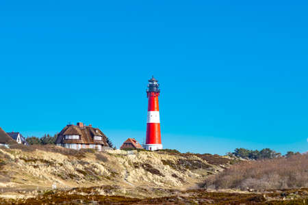 lighthouse of Hoernum on Sylt island, Germany. Landmark, tourist attraction and guiding light for navigation on the North Sea.の写真素材