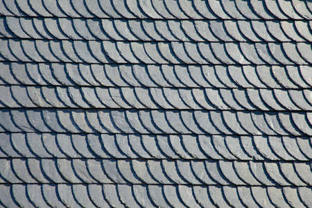 the roof is made of slate slabs. Background and texture, close up