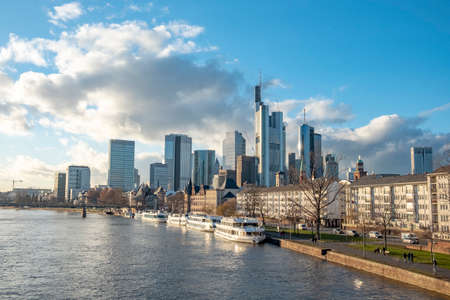Frankfurt, Germany - January 14, 2019: skyline of Frankfurt am Main with ships on river Main.のeditorial素材