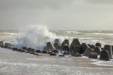 wind breaker on the coast in Sylt in bad weather storm, Hoernumの写真素材