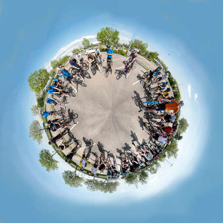 Frankfurt, Germany - May 7, 2022: Group of bicycle athletes meet and discuss the route before starting the race.のeditorial素材