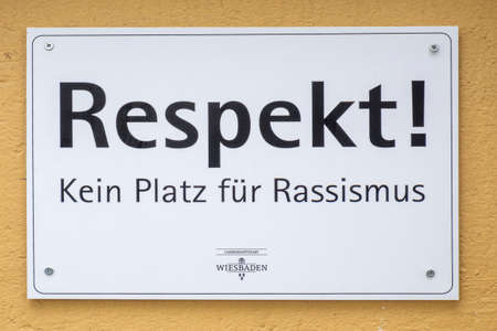 Wiesbaden, Germany - May 7, 2022: sign Respect no place for racism, Wiesbaden - engl: respect, no place for racism, Wiesbaden - at a house wall in Wiesbaden, Germany.のeditorial素材