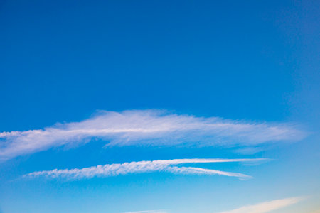background of blue sky with small soft clouds as harmonic background