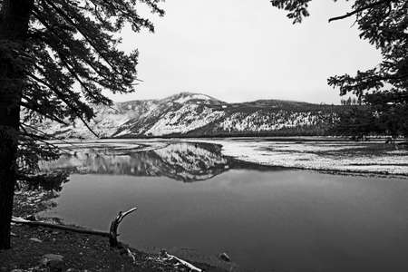scenic river landscape in winter at the yellowstone national park near west entranceの写真素材