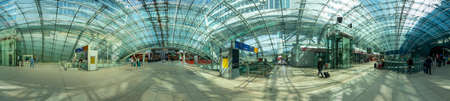 Frankfurt, Germany - May 13, 2022: people in the modern business and train station building the...