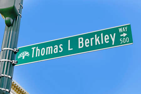 Oakland, USA - Jun 19, 2022: street sign Thomas L Berkley street in Oakland, San Francisco.のeditorial素材