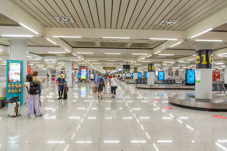 Palma de Mallorca, Spain - June 17, 2022: people pick up the baggage at Palma de Mallorca airport.のeditorial素材