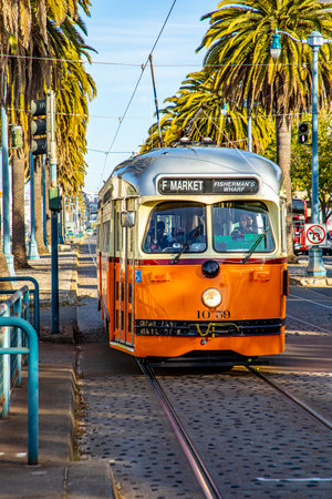 San Francisco, USA - June 6, 2022: yellow vintage bus operates from Fisherman's wharf to market...