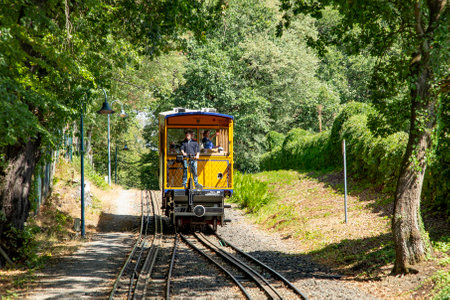 Wiesbaden, Germany - September 2, 2022: the historic yellow water driven train - Nerobergbahn - at the Neroberg in operation.のeditorial素材