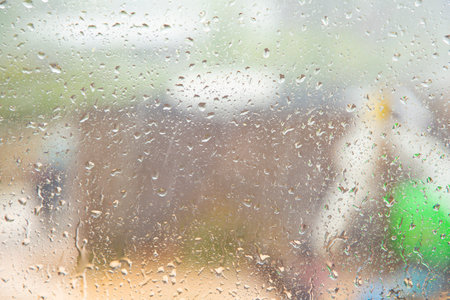 pattern of raindrops at the window in heavy rain