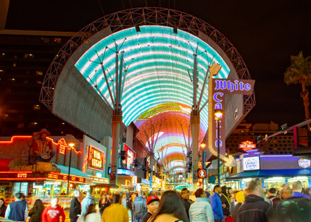 Las Vegas, USA - March 9, 2019: Fremont Street with many neon lights and tourists in downtown Las Vegas. It was the first paved street in Las Vegas in 1925.のeditorial素材